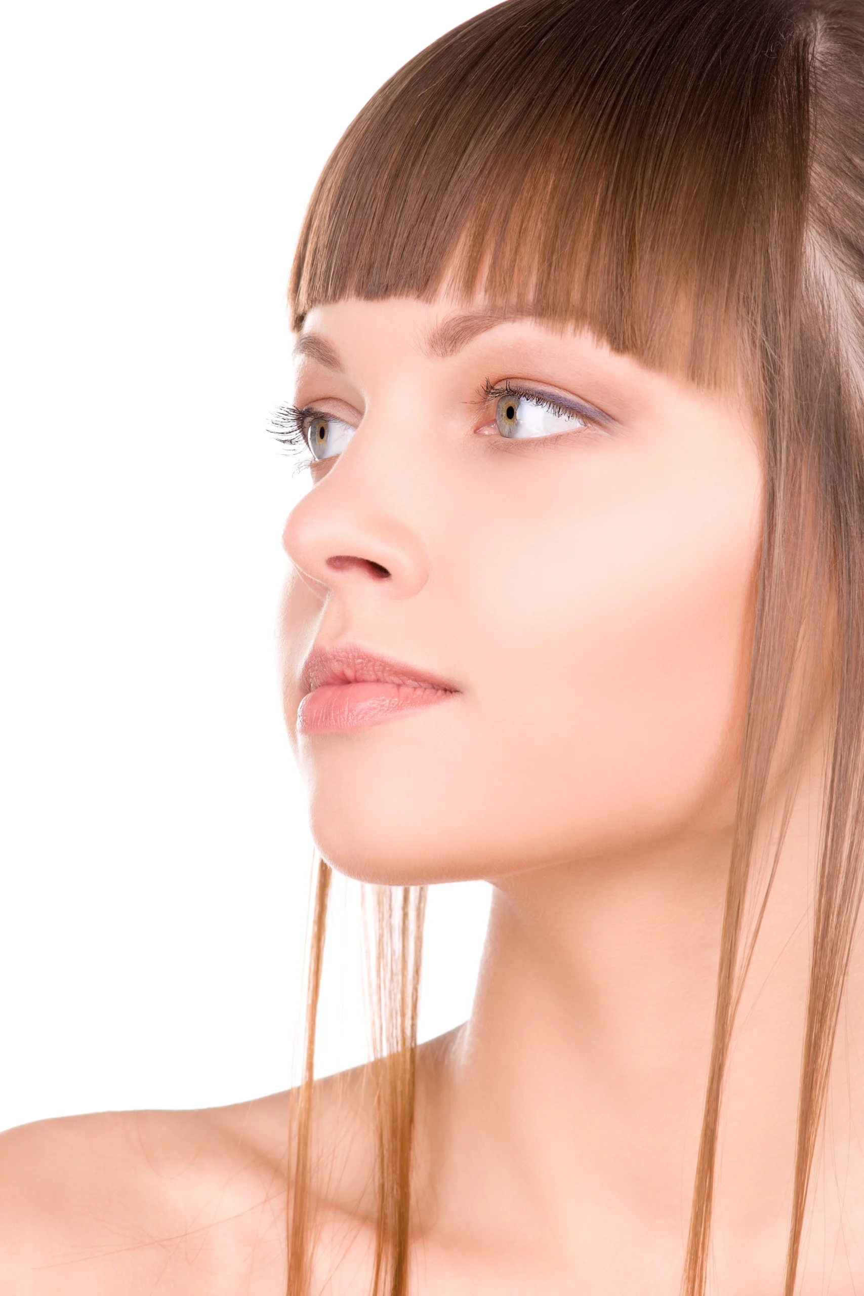 A profile view of a woman with a straight, refined nasal bridge and tip, illustrating the aesthetic goals of Rhinoplasty Tip Reshaping.