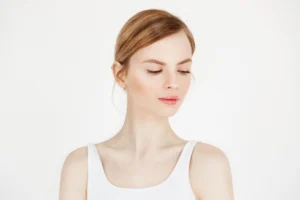 A medical professional examining a patient's nose to determine if a Septoplasty is required to correct a deviated septum.