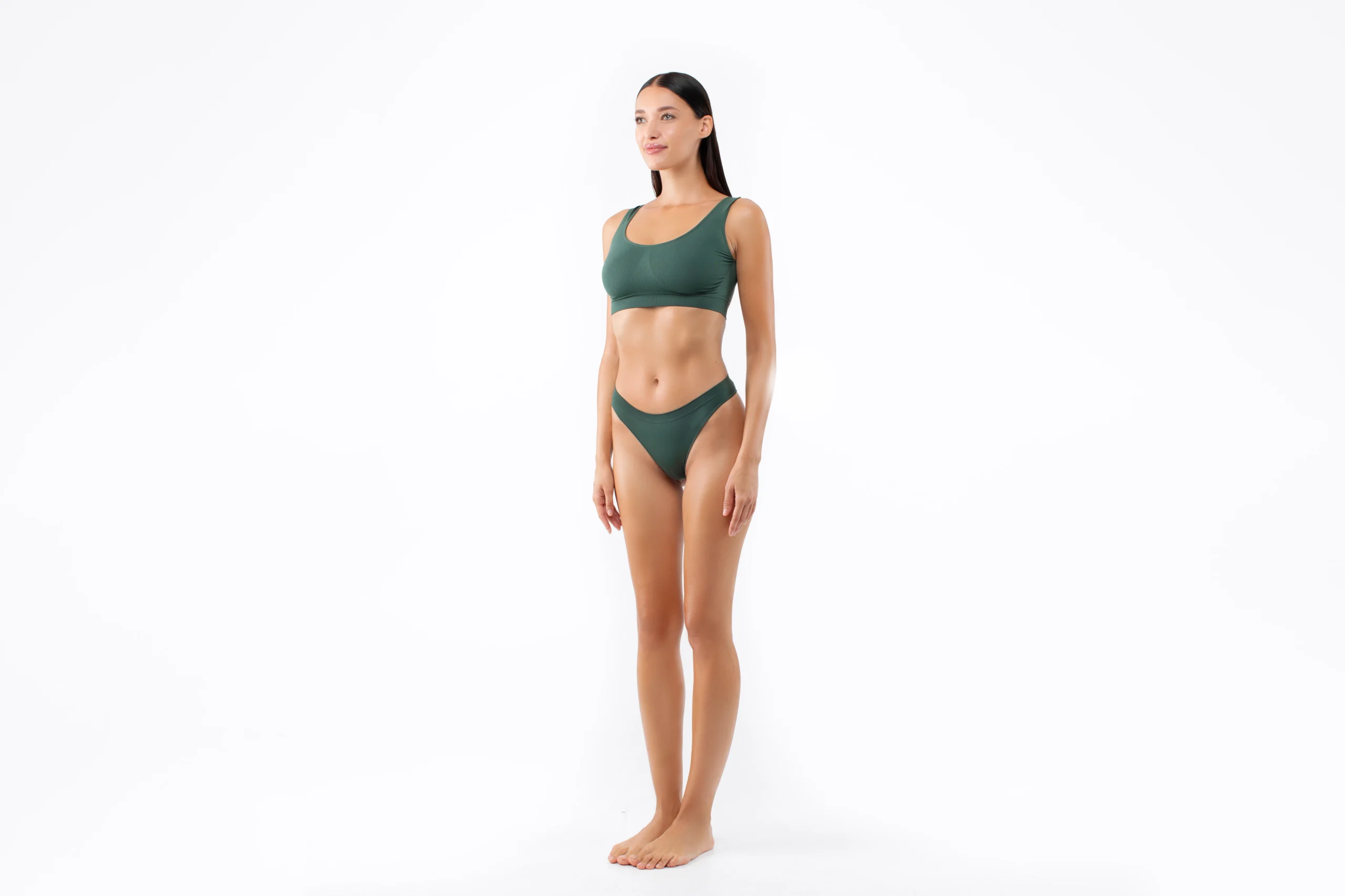 Lateral view of a patient demonstrating truncal symmetry and dermal redraping following Body Contouring Treatments in Dubai.