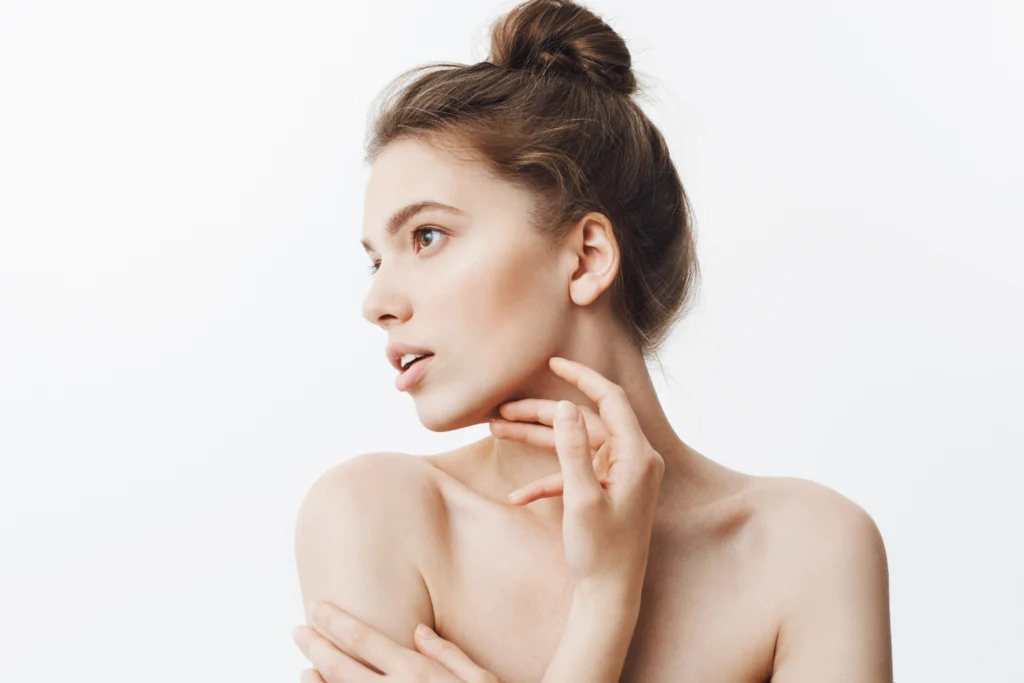 A profile view of a patient highlighting the mandibular border and submental area, essential for evaluating different types of chin liposuction in Dubai.