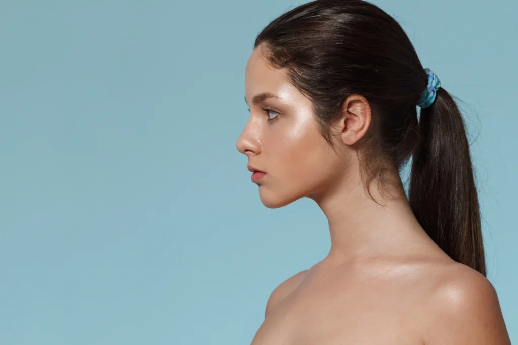 Lateral profile view illustrating the submental region and mandibular definition required for a good candidate for Chin Liposuction in Dubai.