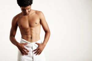 Anterior visualization of a male patient displaying well-defined abdominal musculature and symmetric pelvic vectors suitable for V Sculpt Liposuction in Dubai.
