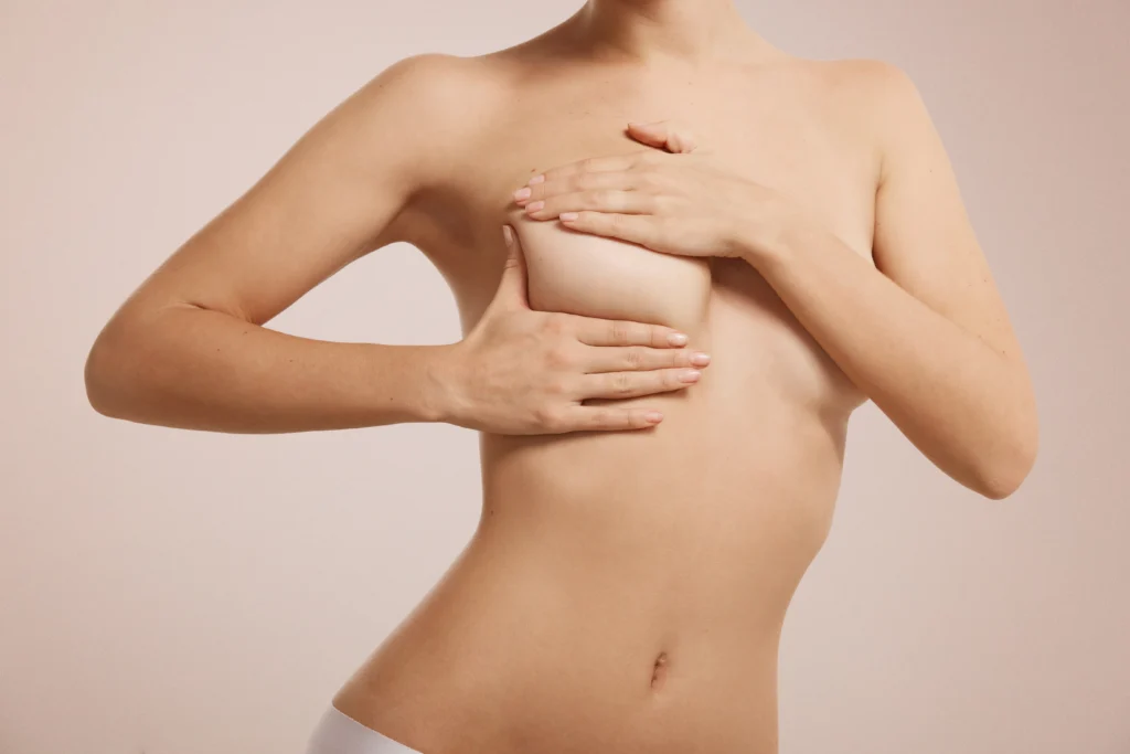 Anterior view of manual mammary parenchyma assessment for Breast Augmentation in Dubai candidacy.