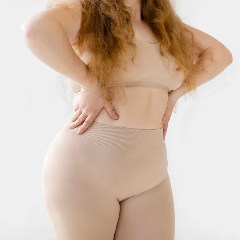 confident-woman-posing-while-wearing-body-shaper