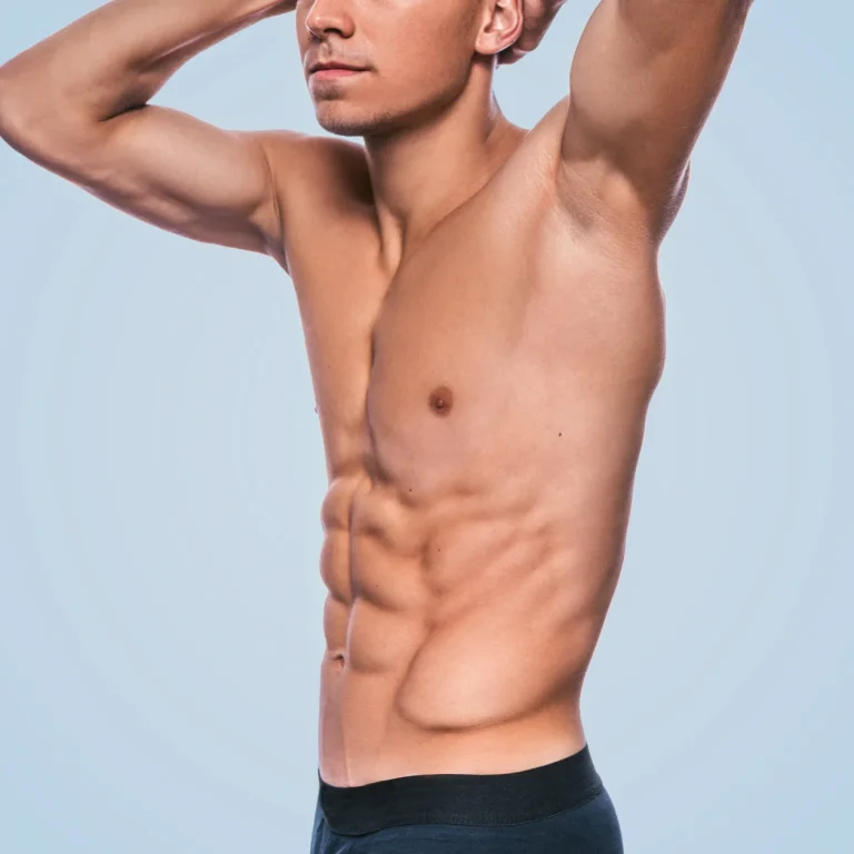 horizontal-image-fitness-muscular-male-model-black-underwear-showing-his-abdominal-press-blue-background-cropped-head-portrait-sporty-healthy-strong-athletic-man-with-sexy-torso
