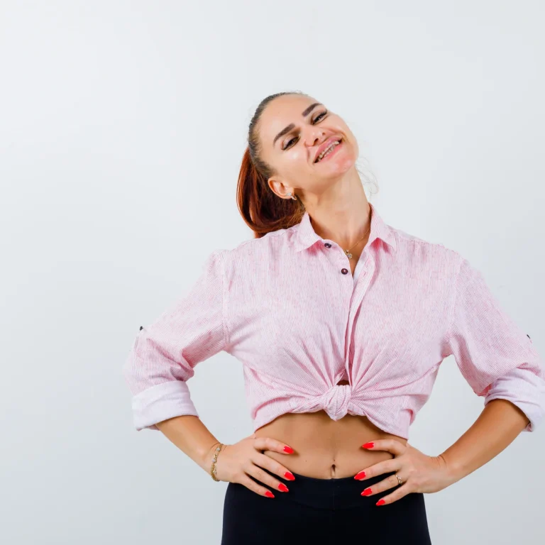 portrait-young-female-keeping-hand-hip-casual-shirt-looking-attractive-front-view