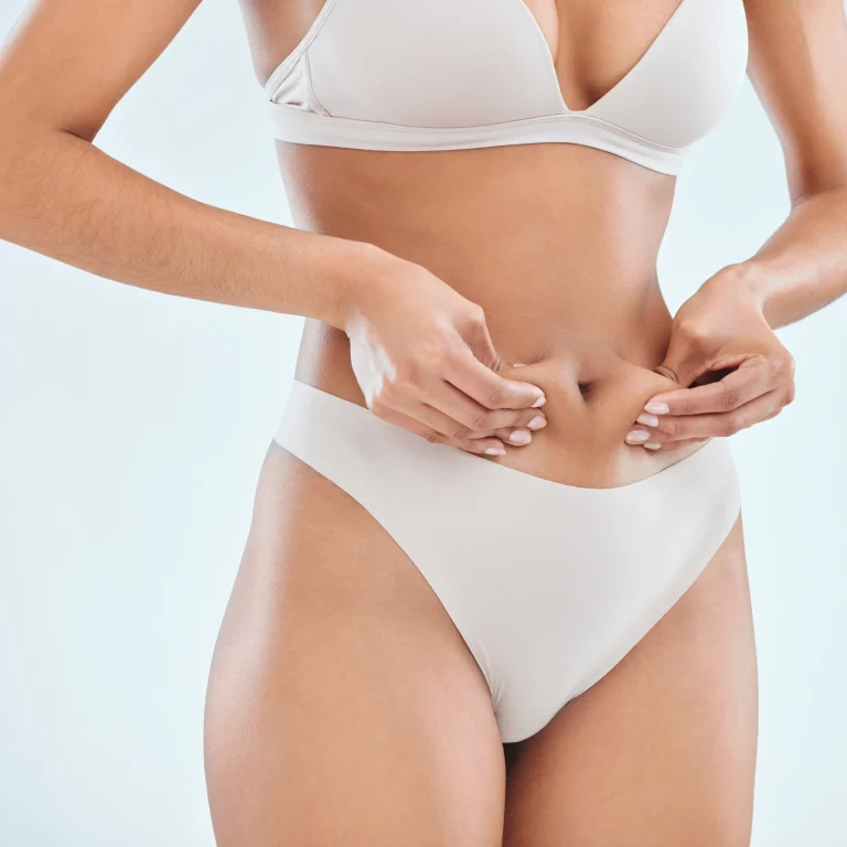 Surgical evaluation of subcutaneous adipose tissue and dermal laxity for How to Plan Your Tummy Tuck Surgery Dubai.