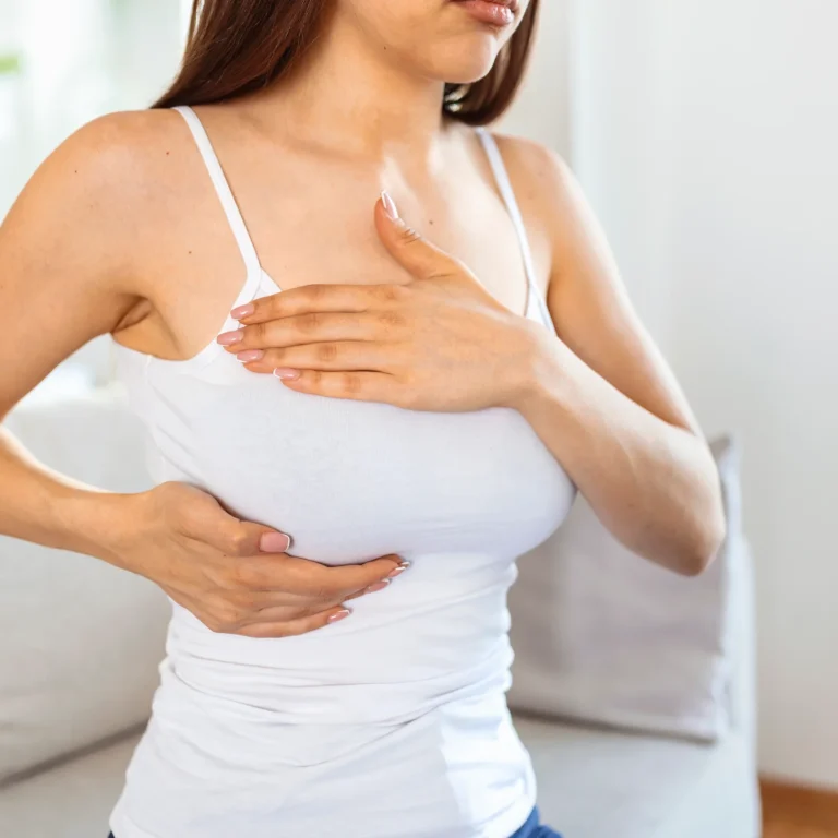 young-caucasian-woman-palpating-her-breast-by-herself-that-she-concern-about-breast-cancer-healthcare-breast-cancer-concept